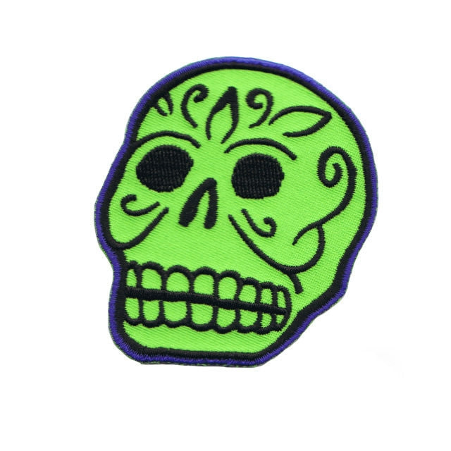Embroidered green and black sugar skull patch by artist Rob Kruse
