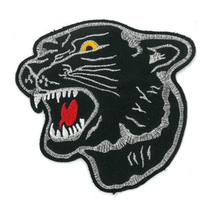fierce black panther head patch with red tongue, yellow eyes, and metallic silver stitched details embroidered patch