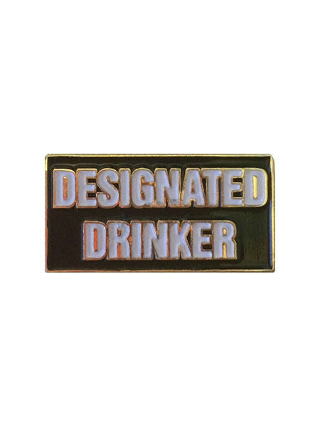 "DESIGNATED DRINKER" in white block letters on black background 1" rectangular gold metal enameled pin