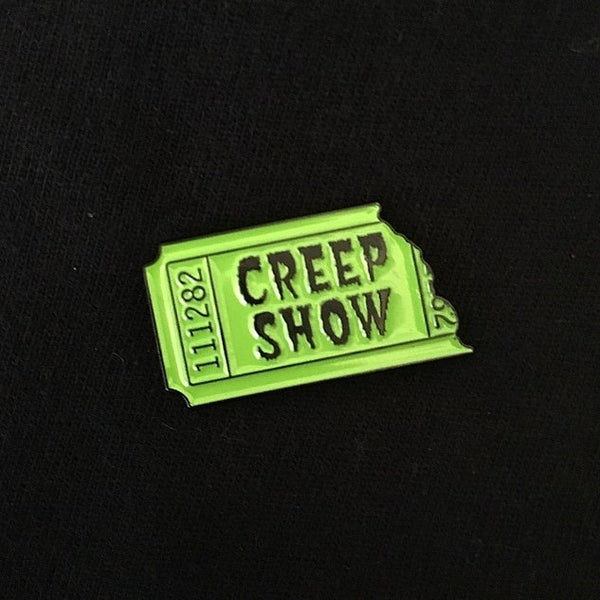 1.25" toxic green glow-in-the-dark "Creep Show" ticket stub enameled black metal pin