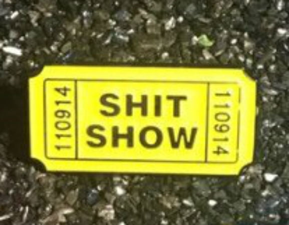 1.25" bright yellow glow-in-the-dark "Shit Show" ticket soft enameled black metal pin