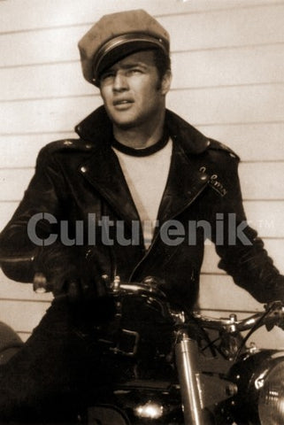 Black & white photo image of Marlon Brando in character as Johnny sitting on a Moto Guzzi motorcycle (not used in the movie) publicity photo for the 1953 film The Wild One