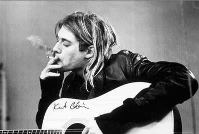36" x 24" poster, black & white photo image of Kurt Cobain seated with guitar, smoking a cigarette