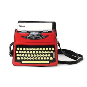 red, black, white vintage typewriter shaped novelty purse with "Dear..." greeting typed on started letter