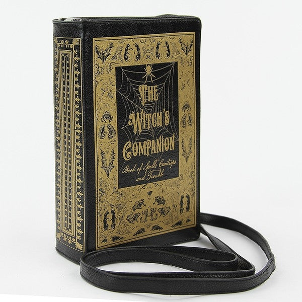 textured black faux leather with metallic gold print book-shaped "The Witch's Companion" clutch purse with detachable wristlet and crossbody straps