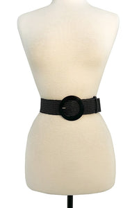 1 3/4" wide woven stretch belt in classic black with matching color circular acetate buckle and a faux leather keeper