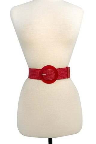 1 3/4" wide woven stretch belt in classic red with matching color circular acetate buckle and a faux leather keeper