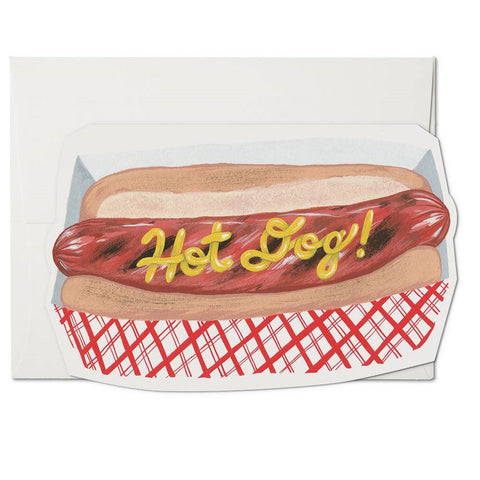 7" x 5" die cut card of "Hot Dog!" in yellow mustard text on hot dog with bun in red and white plaid holder illustrated image