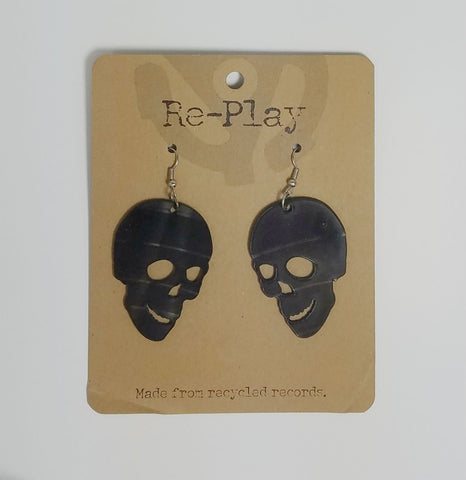 opposing pair 2" black skull earrings made from laser cut recycled vinyl records