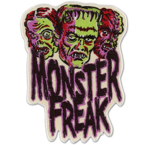 White background pink red green black stitched Phantom, Frankenstein Wolfman heads above "Monster Freak" text 4" x 5 3/8" embroidered patch