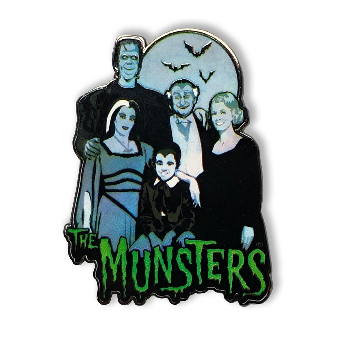 "The Munsters Family" enameled metal 1 5/8" x 2 1/4" clutch back pin, featuring the cast of the campy 60s TV show posing together in front of a full moon