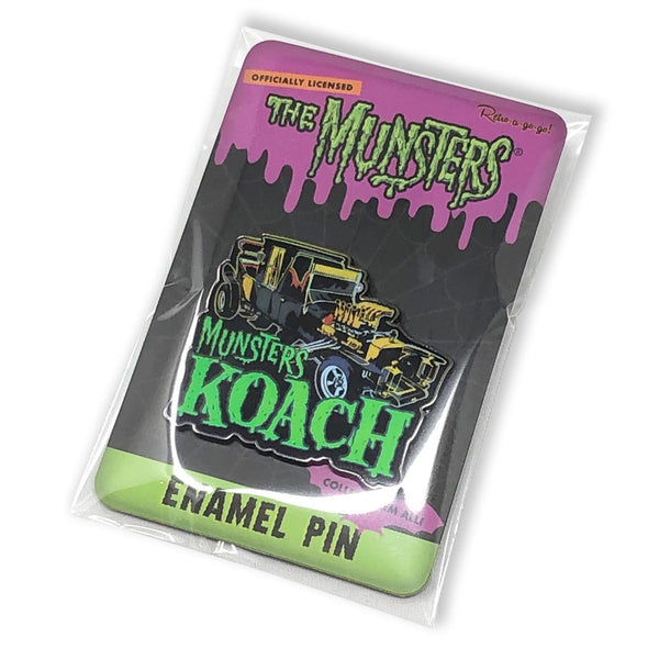 "Munsters Koach" enameled metal 1 5/8" x 1 3/8" clutch back pin, depicting hearse-bodied car built by George Barris for 60's TV show, shown on illustrated backer card packaging