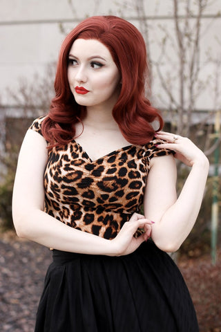 leopard print top in stretch knit with cap sleeves and flattering sweetheart neckline, shown on model