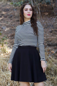 black high waist skater skirt, shown on model wearing it with black and white striped turtleneck top