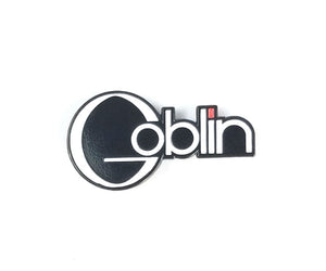 1 1/2" Goblin script logo white, black, and red enameled metal clutch-back pin