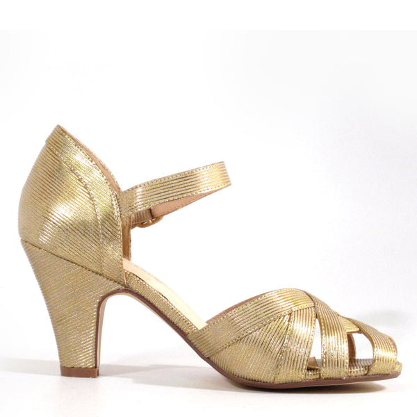 side view of gold peep-toe high heel shoe with buckle closure strap in a gold fabric with a ribbed texture