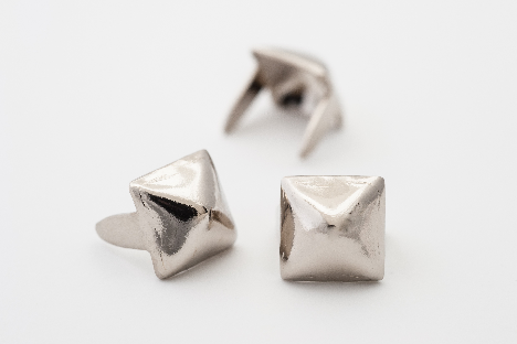 three 1/4" (6mm) silver metal pyramid studs, shown 3 angles