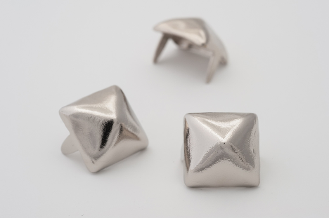 three 1/2" (13mm) silver metal pyramid studs