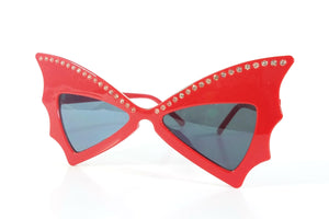 shiny red plastic frame rhinestone embellished batwing shaped sunglasses with dark smoke lens