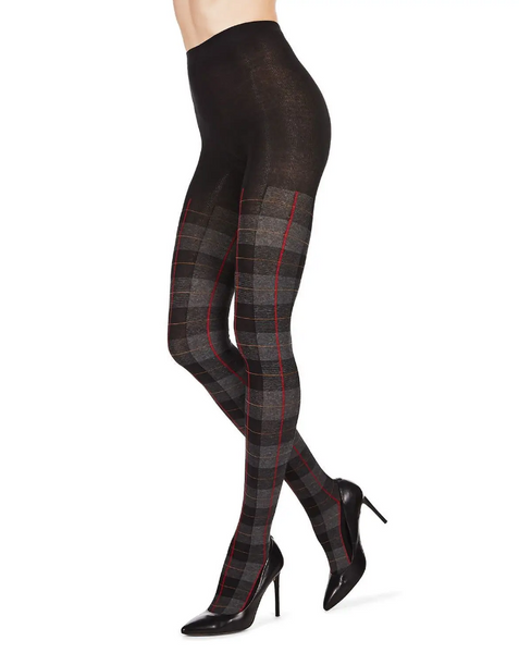 sweater knit tights in a black background plaid with grey, red, and ochre, shown on model