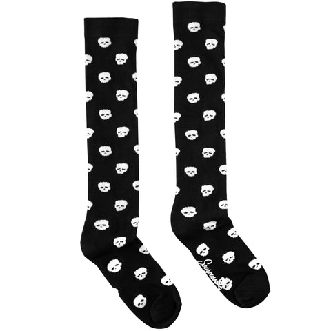 pair black knee socks with allover knit-in white skulls design
