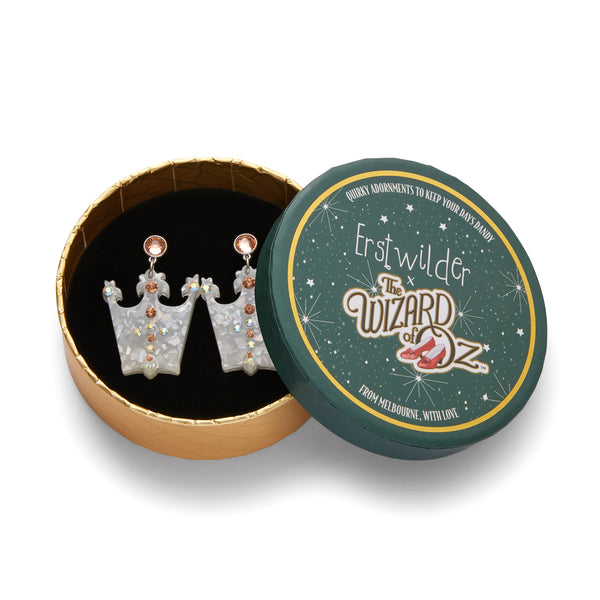 pair Wizard of Oz Collection "The Good Witch's Crown" glitter resin drop earrings with Czech glass crystals, shown in illsutrated round box packaging
