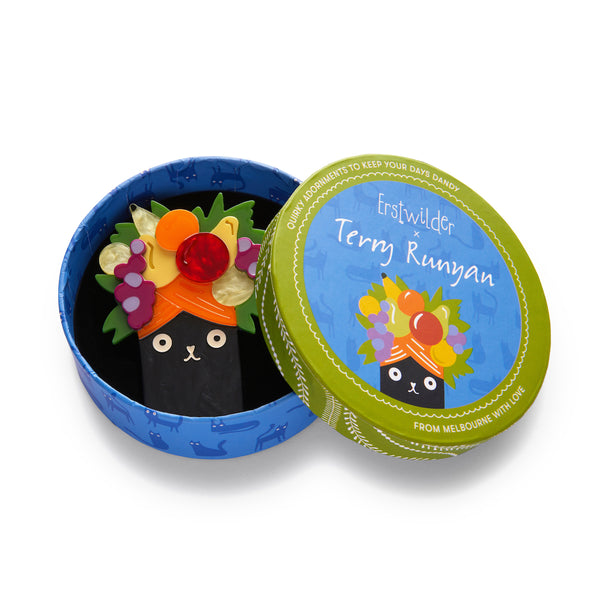 Terry Runyan Collaboration Collection "Catmen Miranda" layered resin black kitty in a fruity turban brooch, shown in illustrated round box packaging