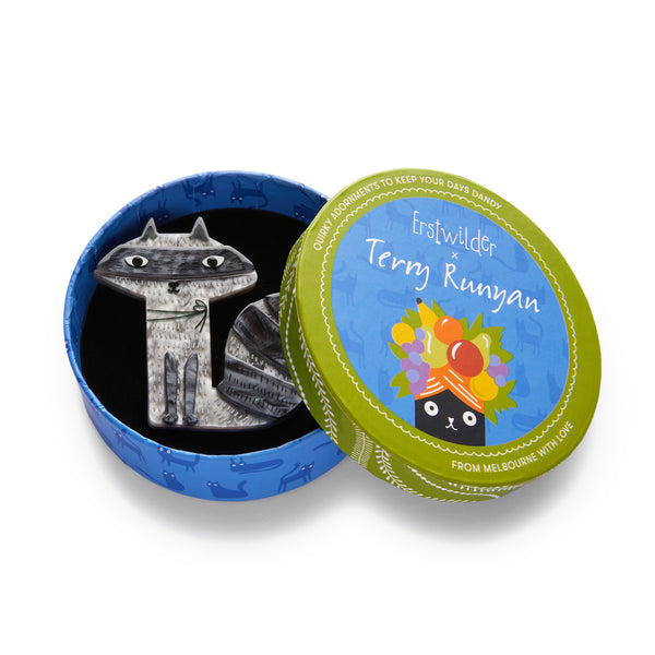 Terry Runyan Collaboration Collection "Sunday Raccoon" layered resin grey and black trash panda brooch, shown in illustrated round box packaging