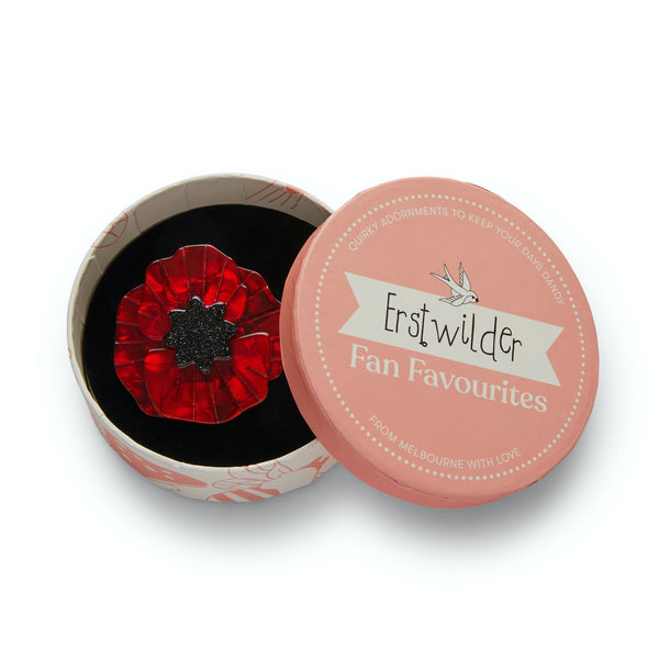 "Poppy Field" marbled red bloom with glitter black center layered resin 2" brooch pin, shown in illustrated round box packaging