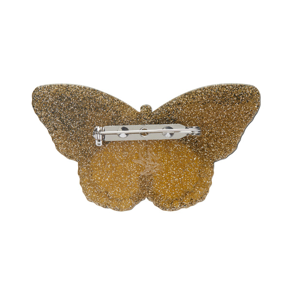Pride & Joy Collection "Prince of Pride" rainbow colored butterfly layered resin brooch, shown gold glitter back view
