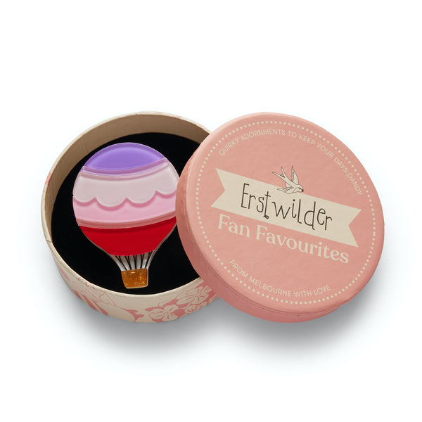 Fan Favourites release "Around the World" hot air balloon brooch, shown in illustrated round box packaging