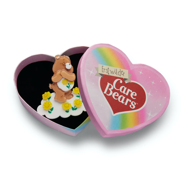 Care Bears Collection "Feeling Friendly" bear with yellow flowers layered resin brooch, shown in illustrated heart-shaped box packaging
