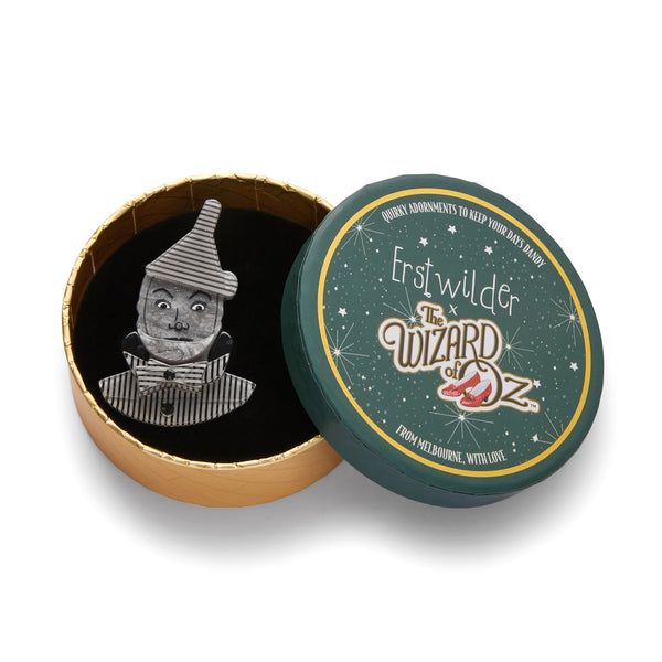 Wizard of Oz Collection "Tin Woodman" portrait layered resin brooch, shown in illustrated round box packaging