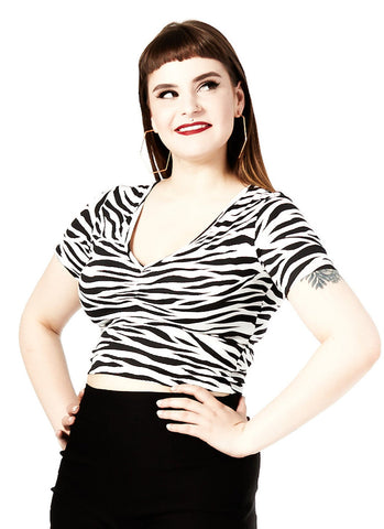 black and creamy white zebra print fitted stretch rayon knit short sleeve women's v-neckline cropped length top, shown on model